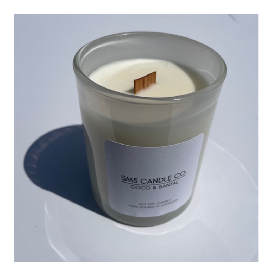 A single white 6oz vessel in Coco & Santal. It smells just like being at the beach. A perfect vaycation scent.
