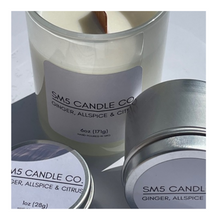Load image into Gallery viewer, This shows our 6oz ghost white vessel with a wooden wick and our 1 and 3oz tin vessels that have cotton wicks.